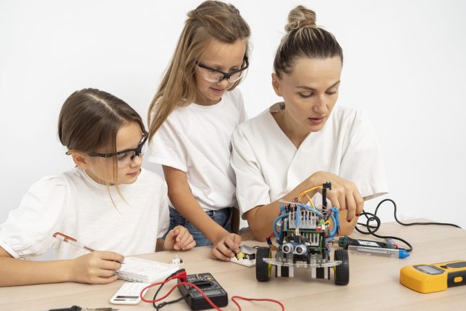 girls-female-teacher-doing-science-experiments-together