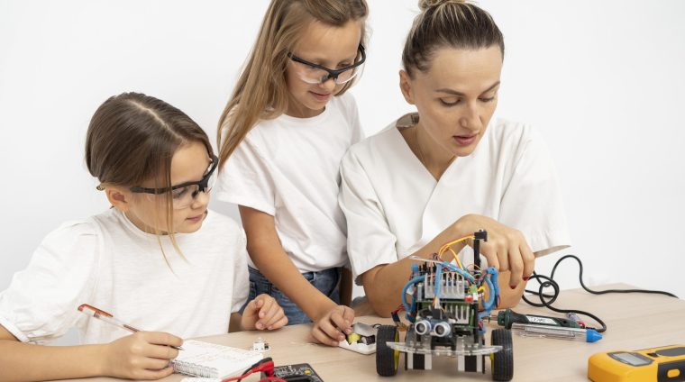 girls-female-teacher-doing-science-experiments-together